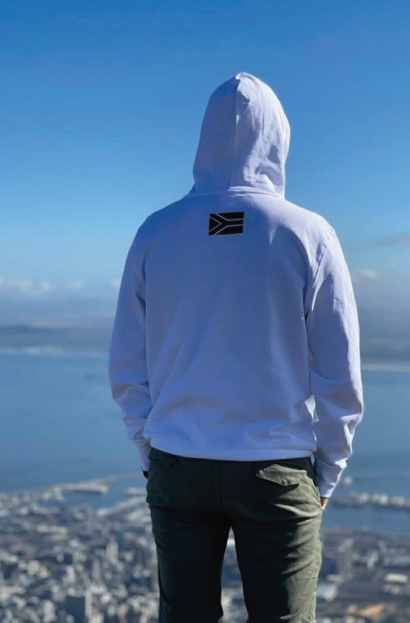 Male wears a custom printed White Hoody on table mountain