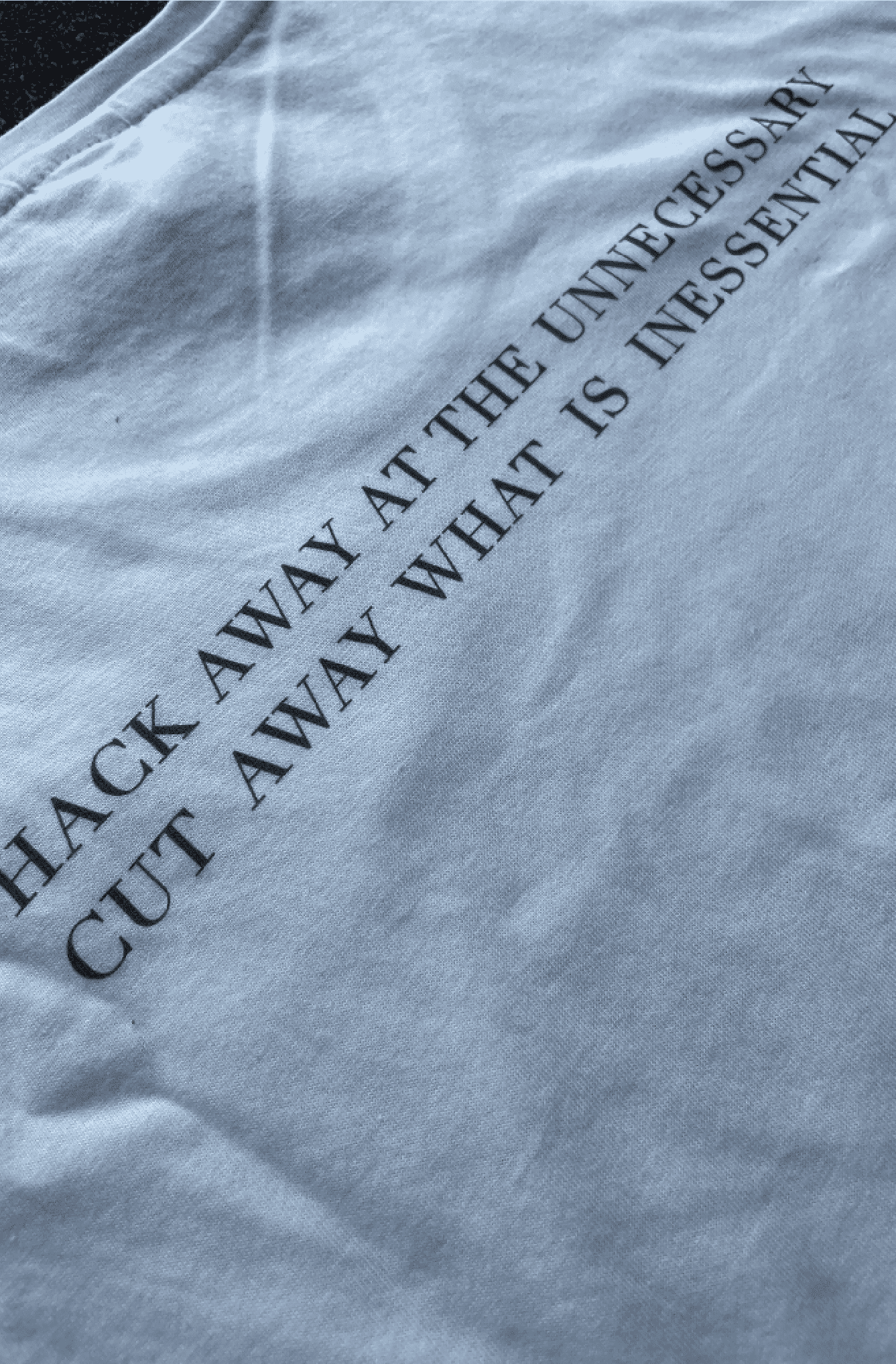 Close up of digital text printed on a white t-shirt