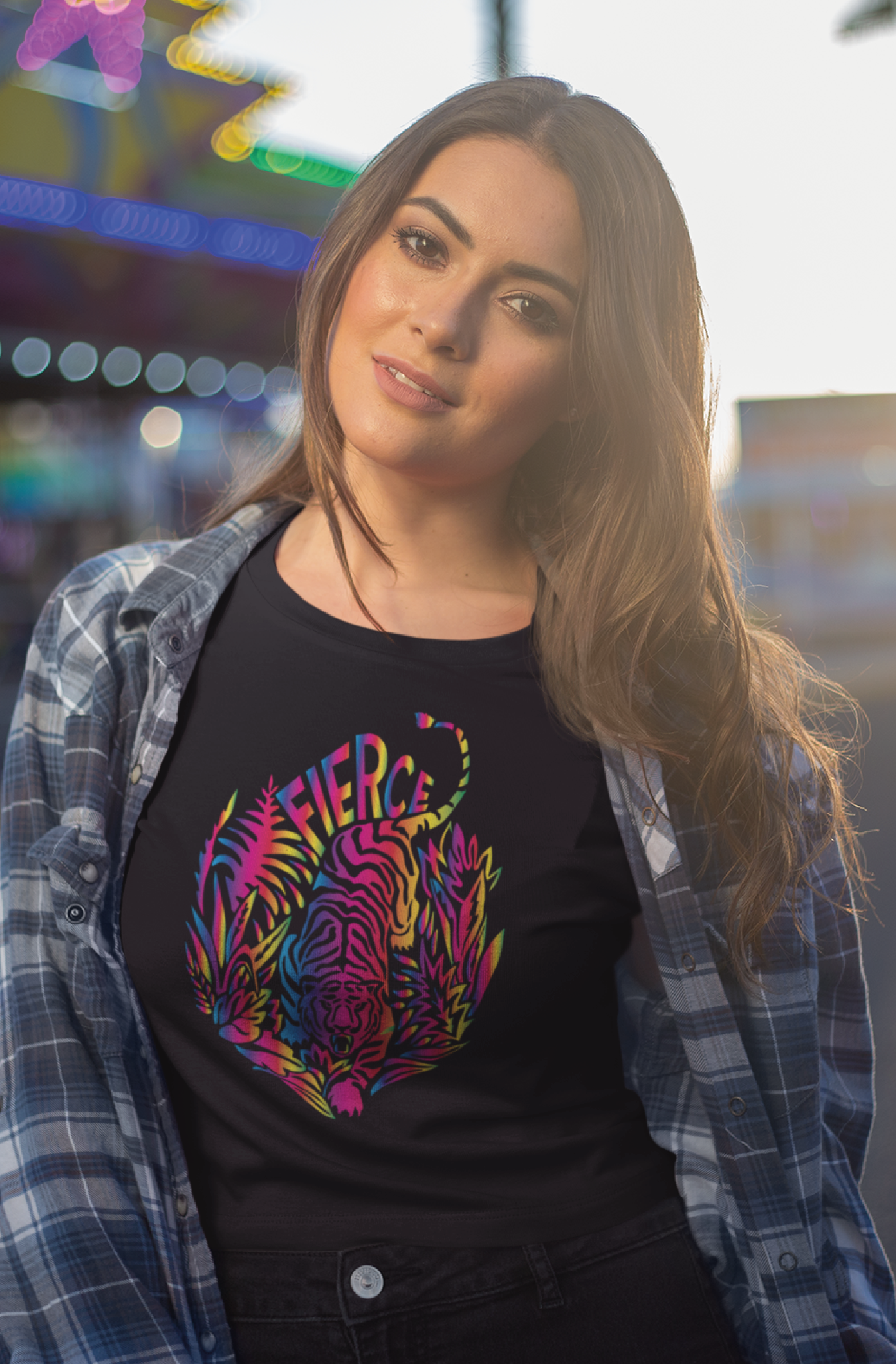 Women tilting her head slightly with long hair outside wears a Black unisex t-shirt with tiger rainbow print