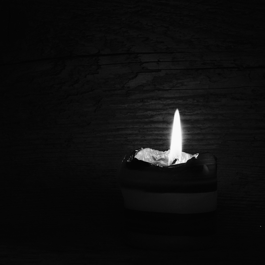 Black and whit image of candle burning
