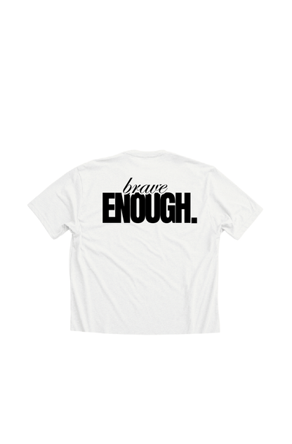 Typographic design with the phrase BRAVE ENOUGH on the back of a ladies white crop top