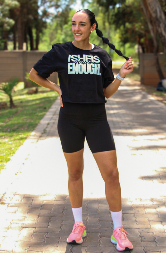 Braver woman wears the She Is Brave Enough print on a black crop top