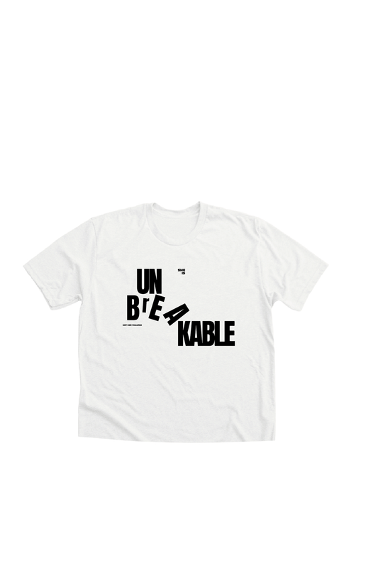 Typographic print with the word UNBREAKABLE printed on a white ladies crop top