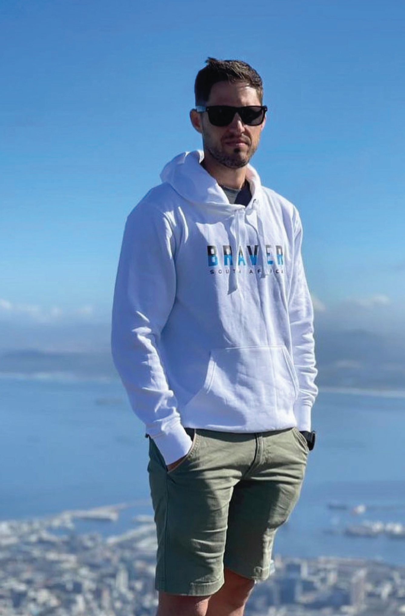 Male wears a custom printed White Hoody on table mountain