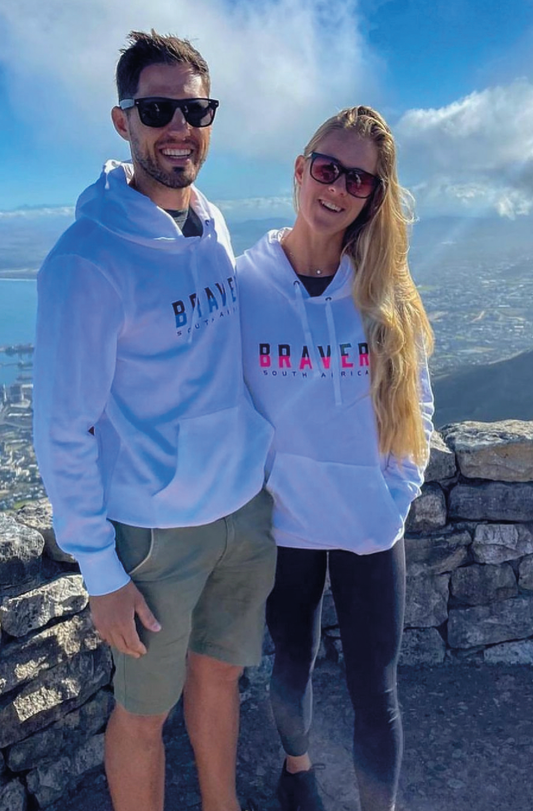 Male and Female wearing custom while hoodies on Table Mountain