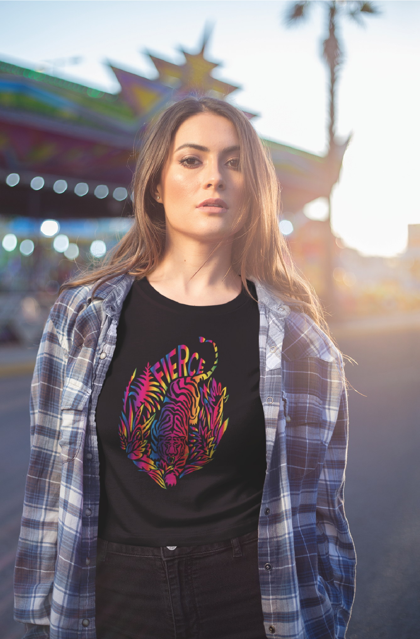 Women with long hair outside wears a Black unisex t-shirt with tiger rainbow print 