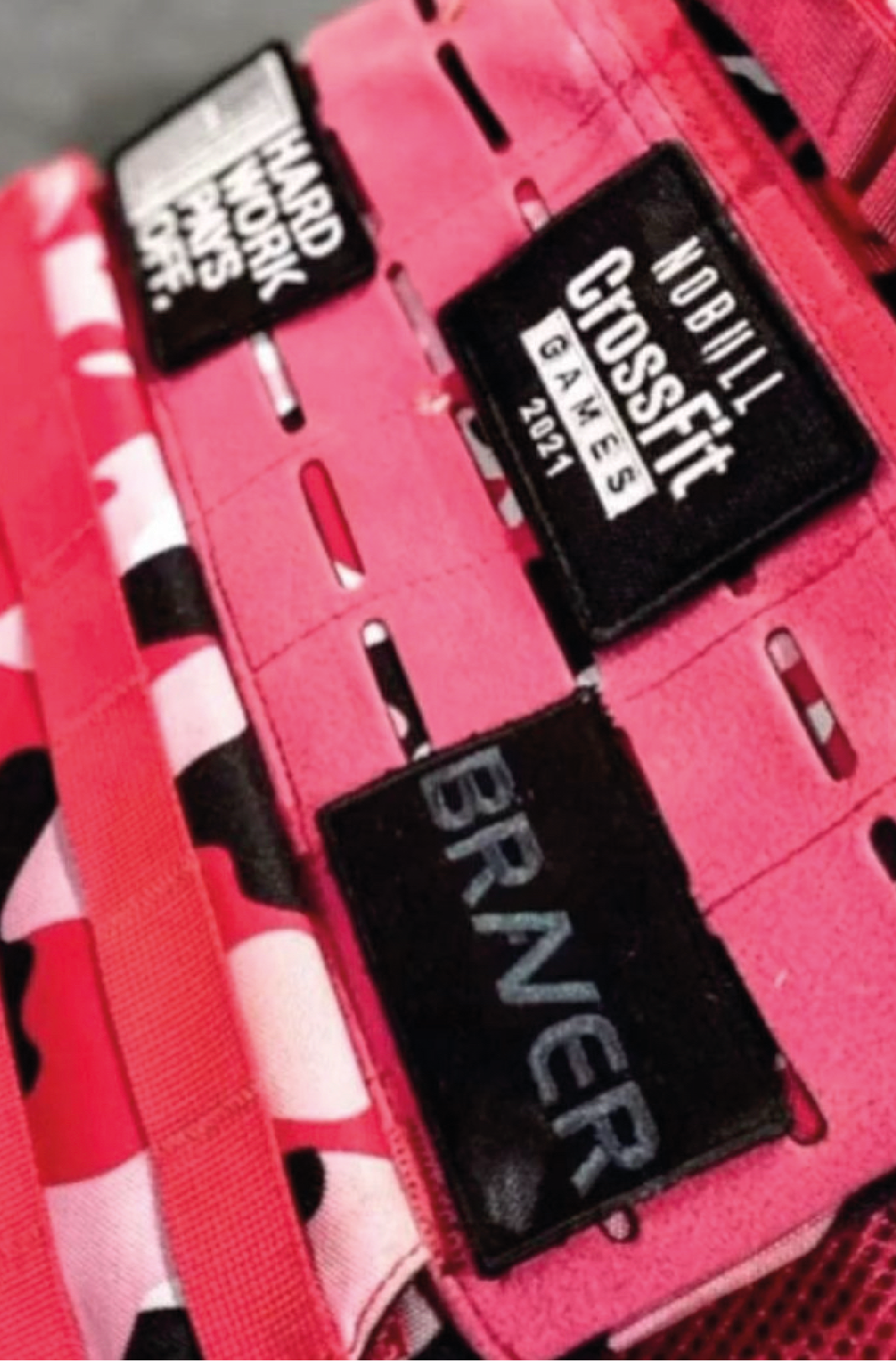 Braver patch on a  pink weight vest with other patches