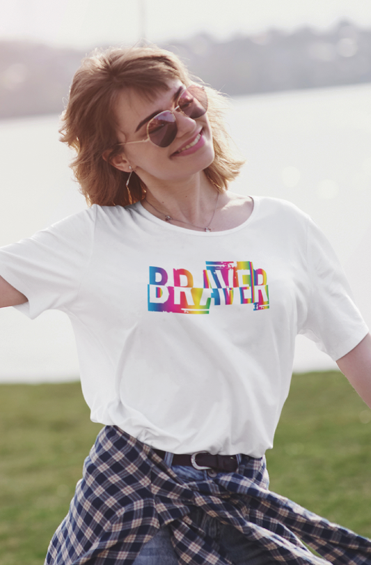 Women smiling  wearing a white braver print in rainbow styled with smart casual shirt and other accessories