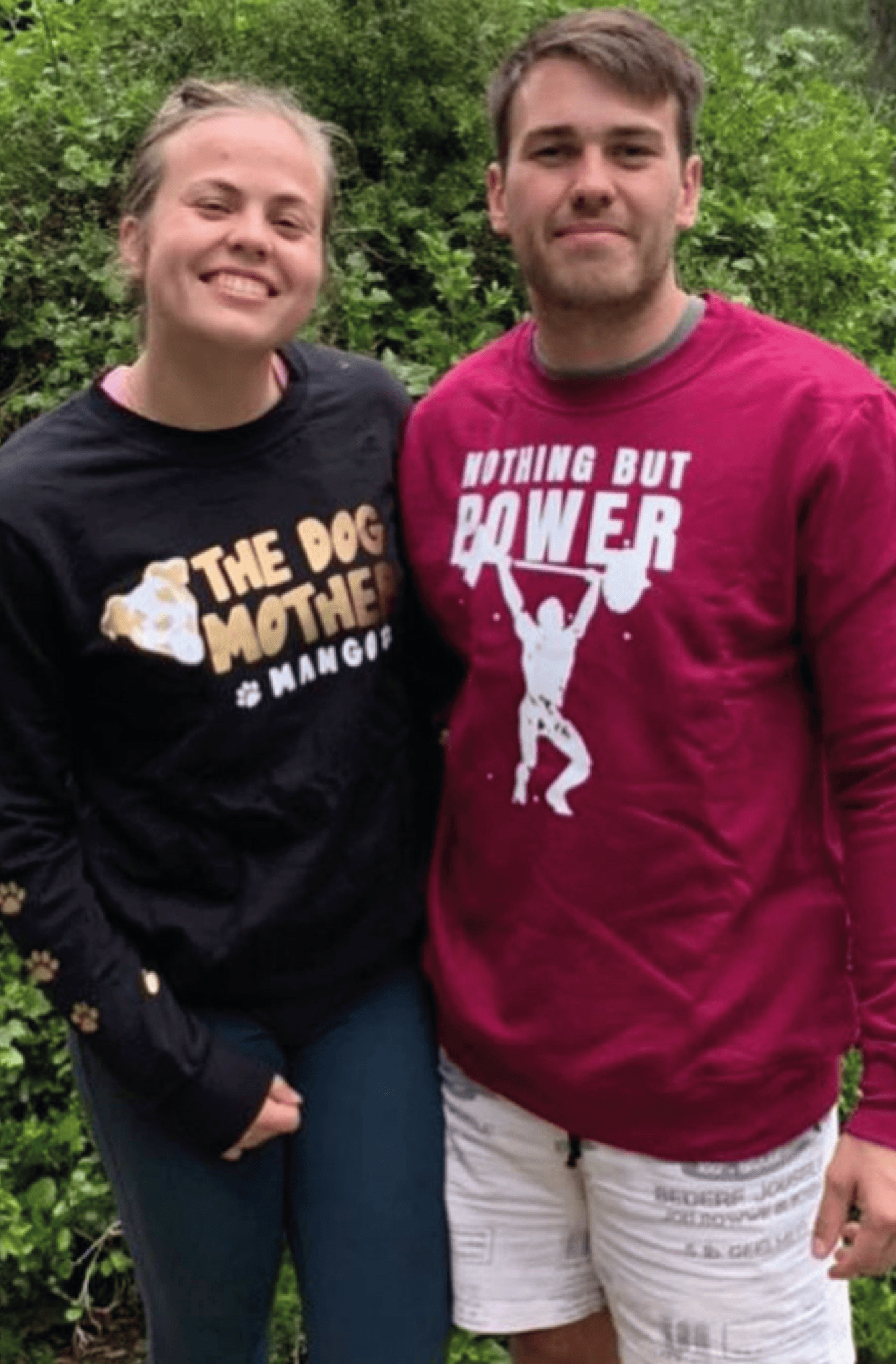 Man and woman together wearing custom printed sweaters in black and maroon